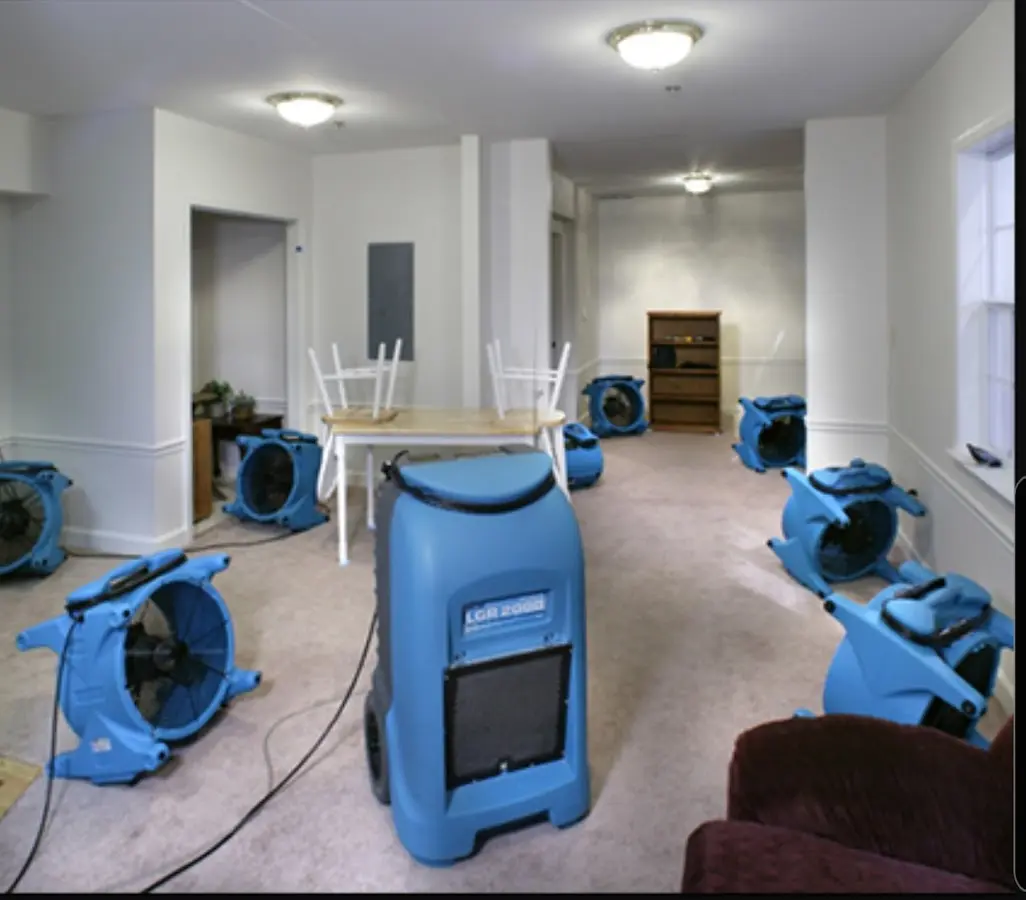 Air movers and dehumidifier setup for Water Damage Restoration in East Greenwich